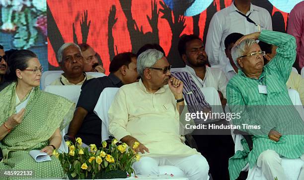 Congress President Sonia Gandhi with Bihar Chief Minister Nitish Kumar and RJD Chief Lalu Prasad during the Swabhiman rally at Gandhi Maidan, on...