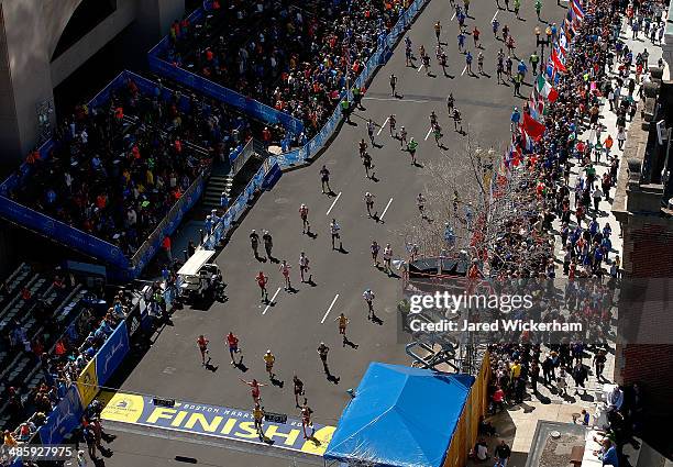 Runners make their way down Boylston Street near the finish line during the 2014 B.A.A. Boston Marathon on April 21, 2014 in Boston, Massachusetts....