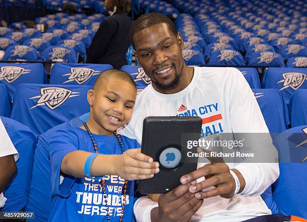 NeVaeh Littleton Make A Wish recipient with Kevin Durant of the Oklahoma City Thunder before the game against the Memphis Grizzlies in Game One of...