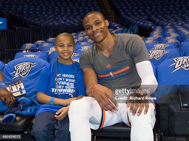 NeVaeh Littleton Make A Wish recipient with Russell Westbrook of the Oklahoma City Thunder before the game against the Memphis Grizzlies in Game One...