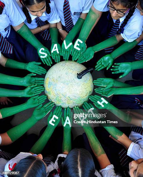 Students of Scholar Fields Public School taking part in awareness program on the eve of World earth day on April 21, 2014 in Patiala, India. Lok...