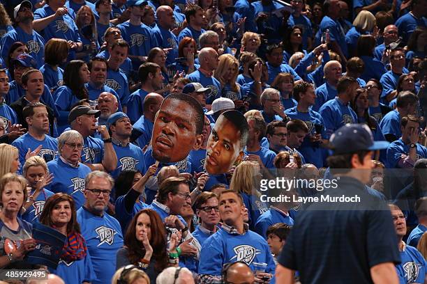 Fans cheer for the Oklahoma City Thunder during the game against the Memphis Grizzlies in Game One of the Western Conference Quarterfinals during the...