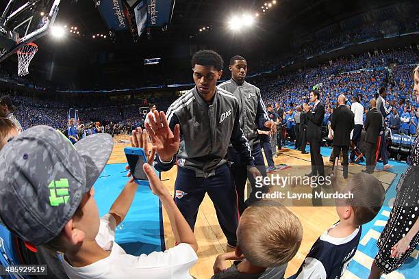 Jeremy Lamb of the Oklahoma City Thunder shakes hands with fans before the game against the Memphis Grizzlies in Game One of the Western Conference...