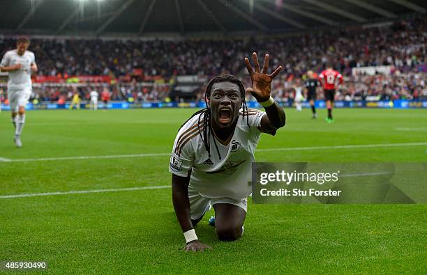 Swansea striker Bafetimbi Gomis celebrates after scoring the second swansea goal during the Barclays Premier League match between Swansea City and...