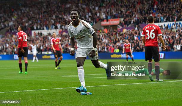 Swansea striker Bafetimbi Gomis celebrates after scoring the second swansea goal during the Barclays Premier League match between Swansea City and...