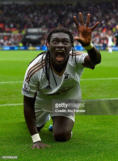 Swansea striker Bafetimbi Gomis celebrates after scoring the second swansea goal during the Barclays Premier League match between Swansea City and...