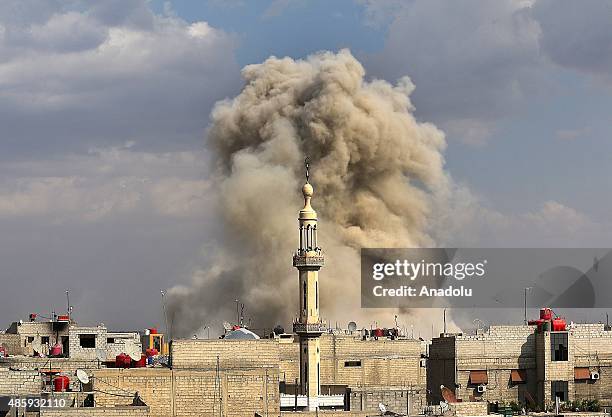 Smoke rises after the war crafts belonging to the Syrian army hit the residential areas in Hamuriye neighborhood of Damascus, Syria on August 30,...