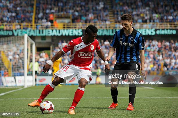 Thomas Meunier of Club Brugge and Imoh Ezekiel of Standard Liege battle for the ball during the Jupiler League match between Club Brugge and Royal...