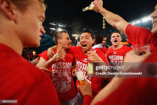 Koeln players celebrate after the Second Bundesliga match between 1. FC Koeln and VfL Bochum at RheinEnergieStadion on April 21, 2014 in Cologne,...