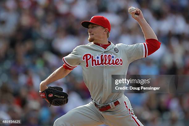 Relief pitcher Jacob Diekman of the Philadelphia Phillies delivers against the Colorado Rockies at Coors Field on April 20, 2014 in Denver, Colorado....