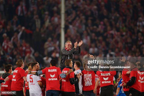 Head coach Peter Stoeger of 1. FC Koeln celebrates with his team during the Second Bundesliga match between 1. FC Koeln and VfL Bochum at...