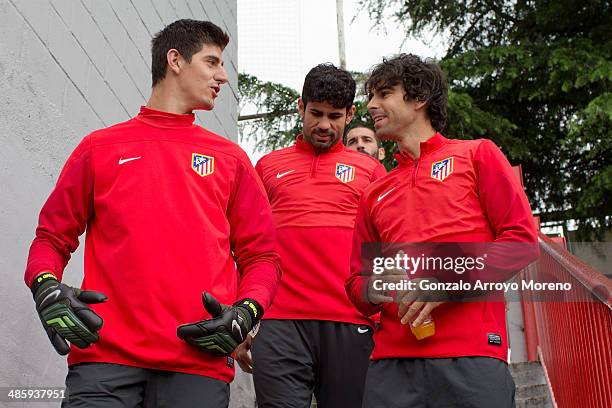 Goalkeeper Thibaut Courtois of Atletico de Madrid enters the pitch with teammates Diego Costa ; Arda Turan and Tiago Mendes prior to start the...