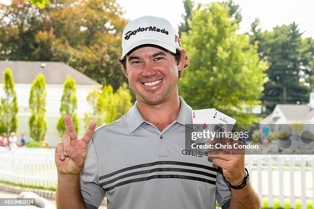 Brian Harman poses with two aces after carding two holes-in-one in the final round of The Barclays at Plainfield Country Club on August 30, 2015 in...