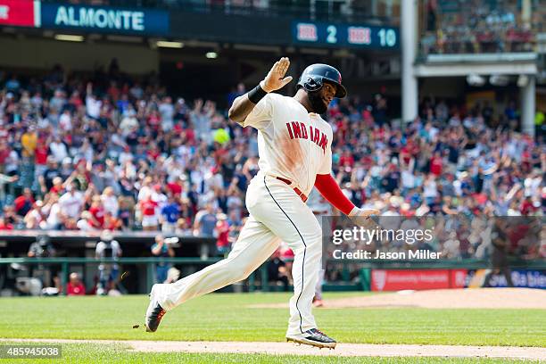 Abraham Almonte of the Cleveland Indians rounds the bases after hitting a grand slam during the fifth inning against the Los Angeles Angels of...