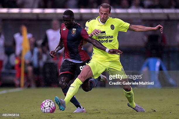 Issa Cissokho of Genoa CFC battles for the ball with Evangelos Moras of Hellas Verona FC during the Serie A match between Genoa CFC and Hellas Verona...