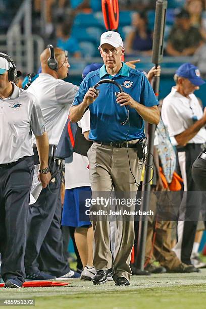 Head coach Joe Philbin of the Miami Dolphins walks the sideline during a time out against the Atlanta Falcons during a preseason game on August 29,...