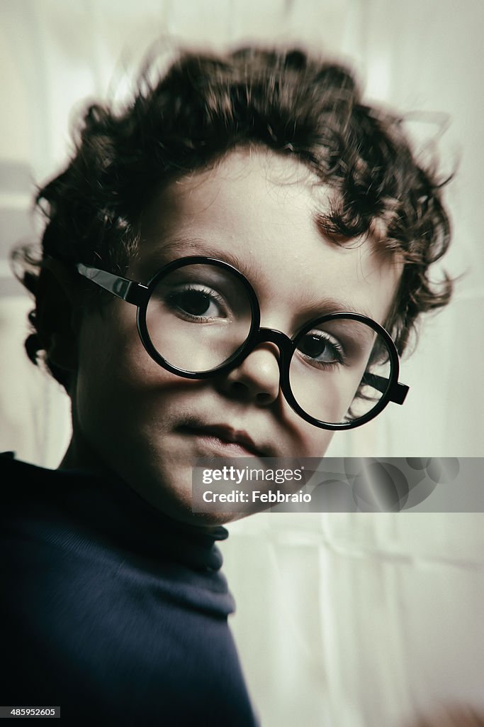 Portrait of child with big round glasses