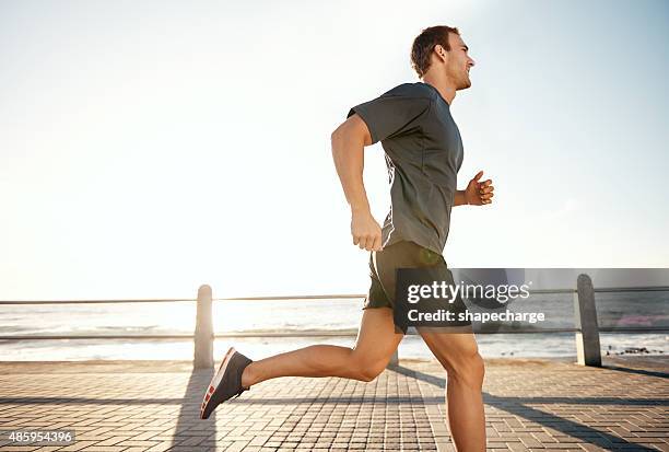 today i shall be one run stronger - male jogging stock pictures, royalty-free photos & images