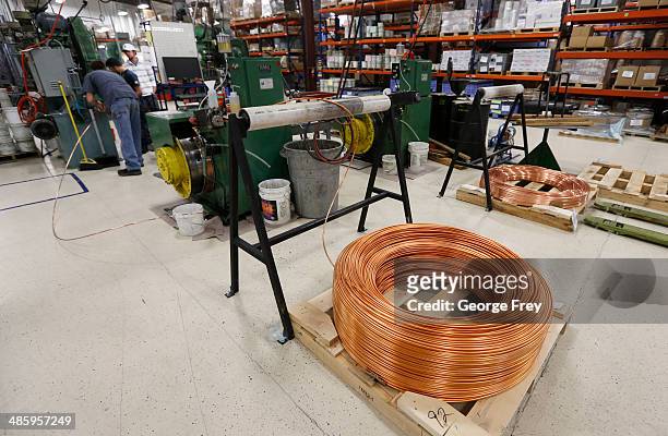 Large coil of copper wire sits on the floor waiting to be manufactured into bullets at Barnes Bullets on April 2014 in Mona, Utah. Barnes says it...