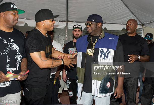 Cool J and Lee "Q" O'Denat attend the 2015 Back-To-School Backpack Giveaway at Jamaica Colosseum Mall on August 30, 2015 in New York City.