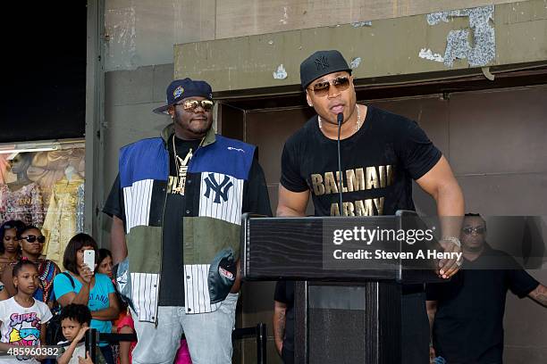 Lee "Q" O'Denat and LL Cool J attend the 2015 Back-To-School Backpack Giveaway at Jamaica Colosseum Mall on August 30, 2015 in New York City.