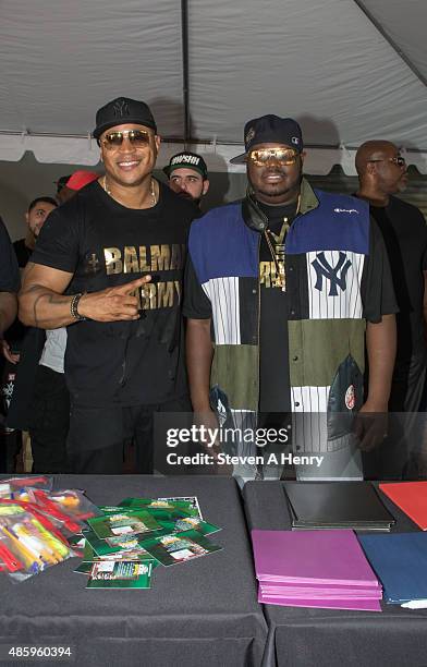 Cool J and Lee "Q" O'Denat attend the 2015 Back-To-School Backpack Giveaway at Jamaica Colosseum Mall on August 30, 2015 in New York City.