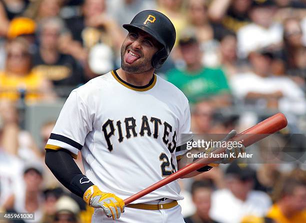 Francisco Cervelli of the Pittsburgh Pirates reacts during an at bat in the fourth inning during the game against the Colorado Rockies at PNC Park on...