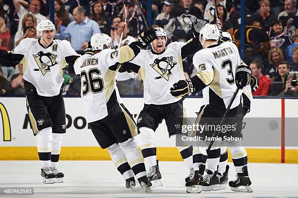 Jussi Jokinen of the Pittsburgh Penguins celebrates his third period game-winning goal with his teammates in Game Three of the First Round of the...