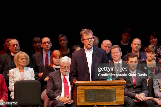 Joe Cobb, Pastor of Metropolitan Community Church of the Blue Ridge speaks at the Interfaith Service of Remembrance and Healing to commemorate the...