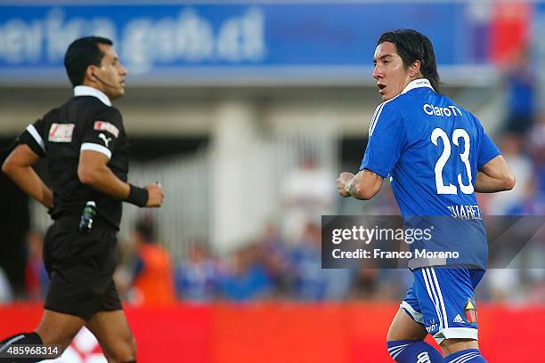 Cristian Suarez of Universidad de Chile celebrates after scoring the third goal of his team during a match between U de Chile and Palestino as part...