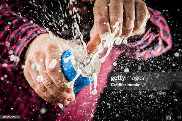 frothy foam splashing out of a tin can - opening can stock pictures, royalty-free photos & images