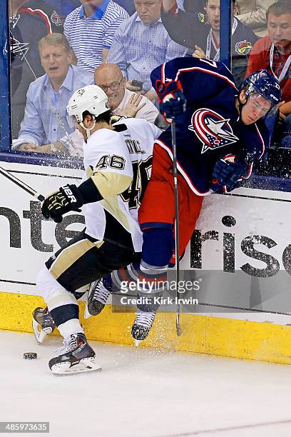 Ryan Murray of the Columbus Blue Jackets checks Joe Vitale of the Pittsburgh Penguins during the second period in Game Three of the First Round of...