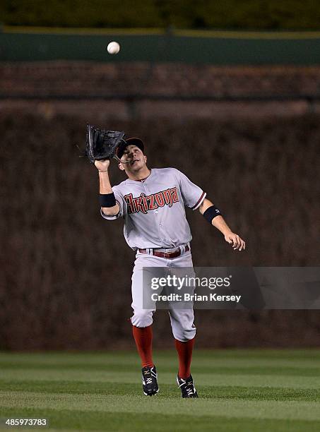 Center fielder Tony Campana of the Arizona Diamondbacks catches a fly ball hit by Welington Castillo of the Chicago Cubs during the fourth inning at...