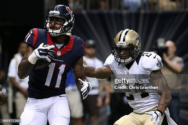 Jaelen Strong of the Houston Texans scores a touchdown over Kyle Wilson of the New Orleans Saints at the Mercedes-Benz Superdome on August 30, 2015...