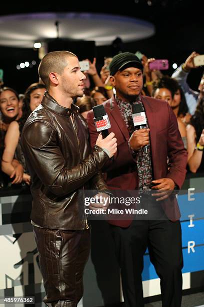 Recording artist Nick Jonas and tv host Sway Calloway visit The Shelter Pet Project during the 2015 MTV Video Music Awards at Microsoft Theater on...