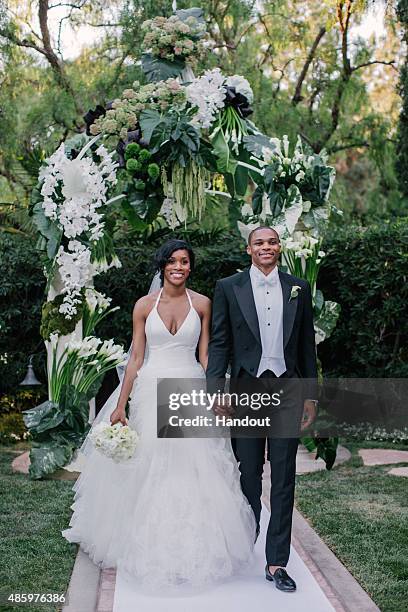 In this handout provided by Russell Westbrook, NBA player Russell Westbrook, point guard for the Oklahoma City Thunder , walks down the aisle with...