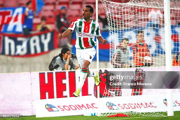 Cesar Cortes of Palestino celebrates after scoring the fourth goal of his team during a match between U de Chile and Palestino as part of fifth round...