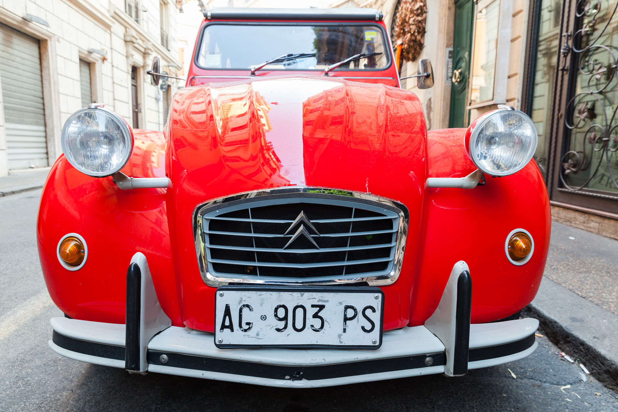 Red oltimer Citroen 2cv6 Special car, front view Red oltimer Citroen 2cv6 Special car, front view