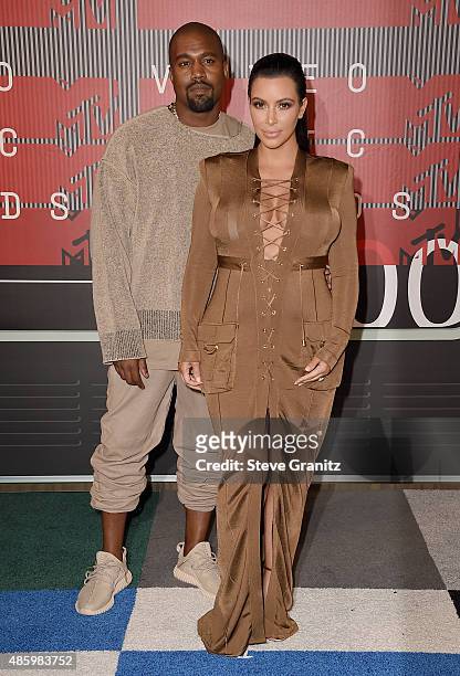 Rapper Kanye West and TV personality Kim Kardashian attend the 2015 MTV Video Music Awards at Microsoft Theater on August 30, 2015 in Los Angeles,...
