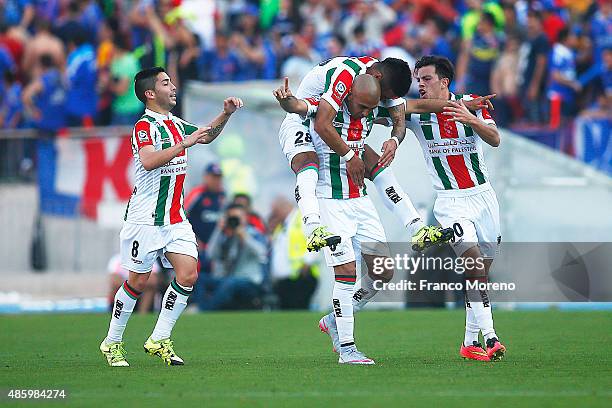 Marcos Riquelme of Palestino celebrates with his teammates after scoring the second goal against U de Chile during a match between U de Chile and...