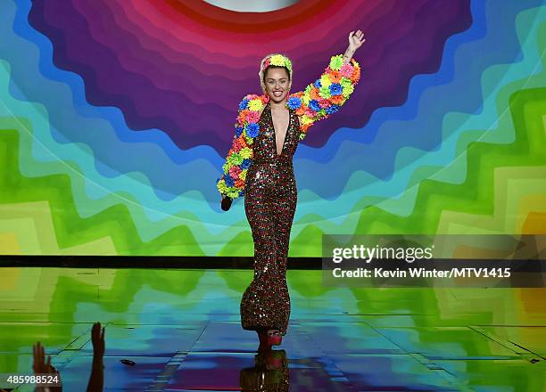 Host Miley Cyrus, styled by Simone Harouche, speaks onstage during the 2015 MTV Video Music Awards at Microsoft Theater on August 30, 2015 in Los...