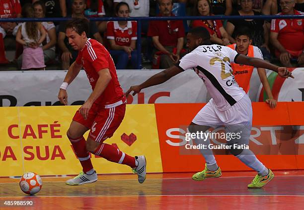 Benfica's player Alan Brandi with AD Fundao's player Teka in action during the Futsal Super Cup match between SL Benfica and AD Fundao at Pavilhao...