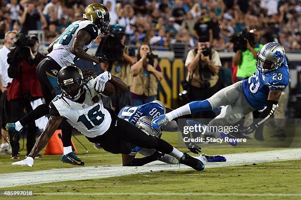 Denard Robinson of the Jacksonville Jaguars is brought down by Devin Taylor of the Detroit Lions during a preseason game at EverBank Field on August...