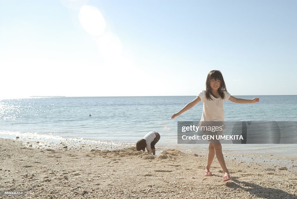 Girl who play on the beach