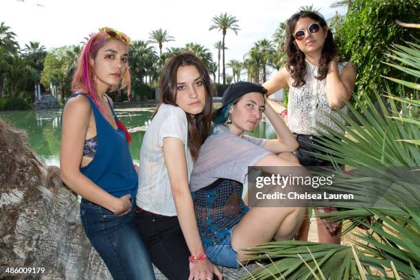 Musicians Jenny Lee Lindberg, Theresa Wayman, Emily Kokal and Stella Mozgawa of Warpaint pose backstage during the Coachella valley music and arts...