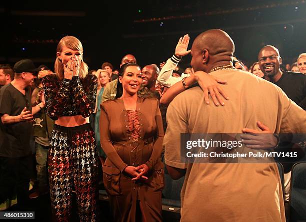 Recording artist Taylor Swift, TV personality Kim Kardashian and recording artist Kanye West attend the 2015 MTV Video Music Awards at Microsoft...