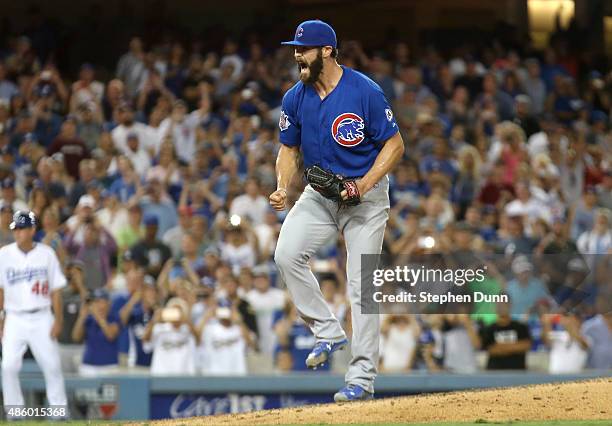 Starting pitcher Jake Arrieta of the Chicago Cubs is surrounded by teammates after getting the final out of a no hitter against the Los Angeles...