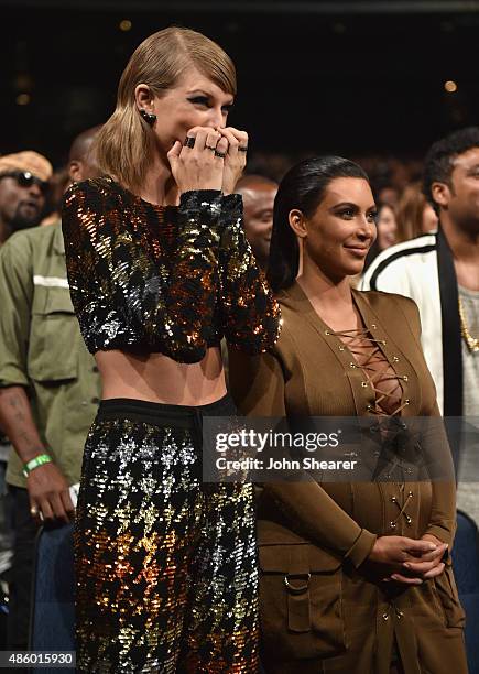 Singer-songwriter Taylor Swift and TV personality Kim Kardashian in the audience during the 2015 MTV Video Music Awards at Microsoft Theater on...