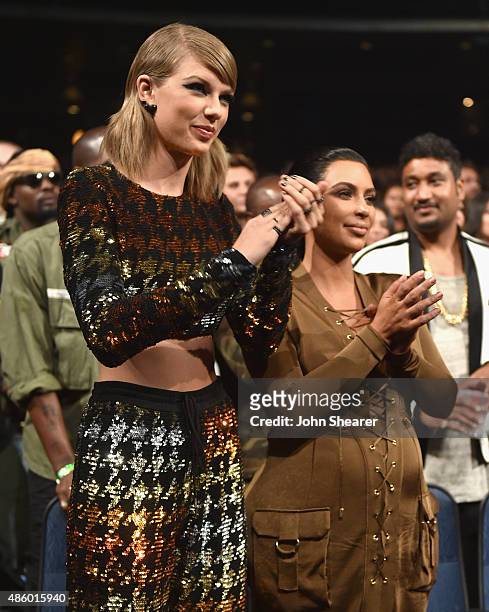 Singer-songwriter Taylor Swift and TV personality Kim Kardashian in the audience during the 2015 MTV Video Music Awards at Microsoft Theater on...