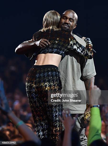 Singer-songwriter Taylor Swift and rapper Kanye West hug onstage during the 2015 MTV Video Music Awards at Microsoft Theater on August 30, 2015 in...